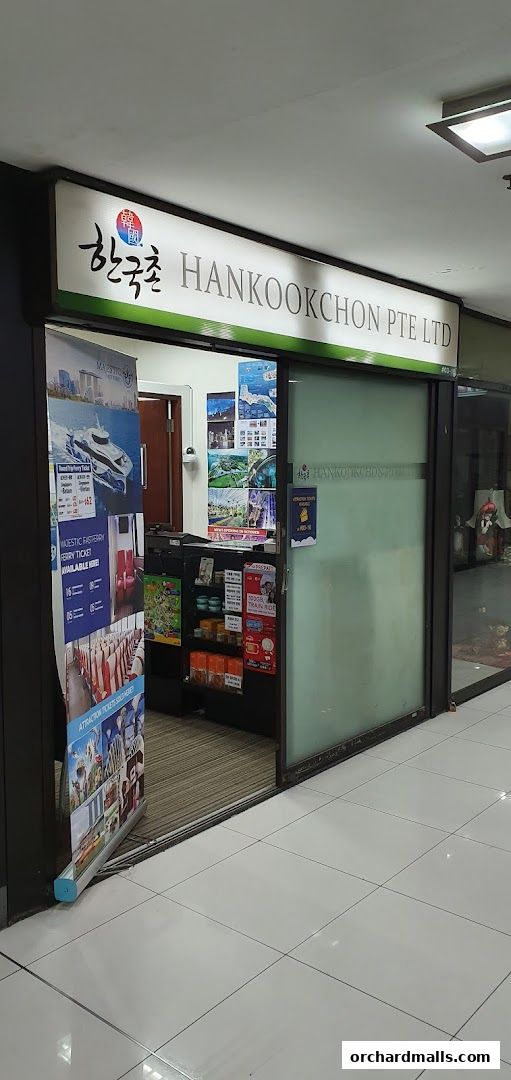The exterior of Hankookchon Pte. Ltd. shop, displaying travel brochures and products.