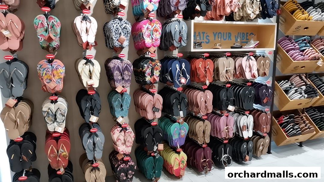 A vibrant display of Havaianas flip-flops in various colors and patterns.