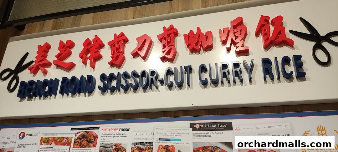 A sign for Beach Road Scissor-Cut Curry Rice with Chinese characters and scissors.