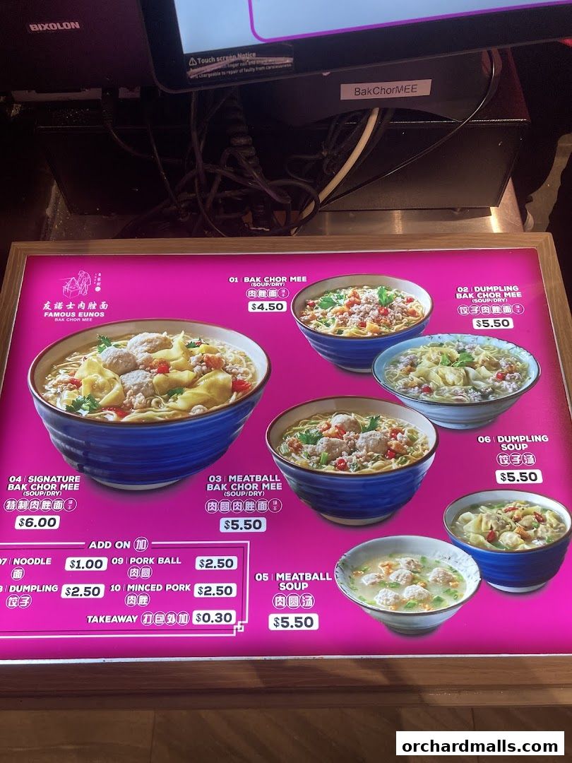 A menu board displaying various noodle and soup dishes with prices.