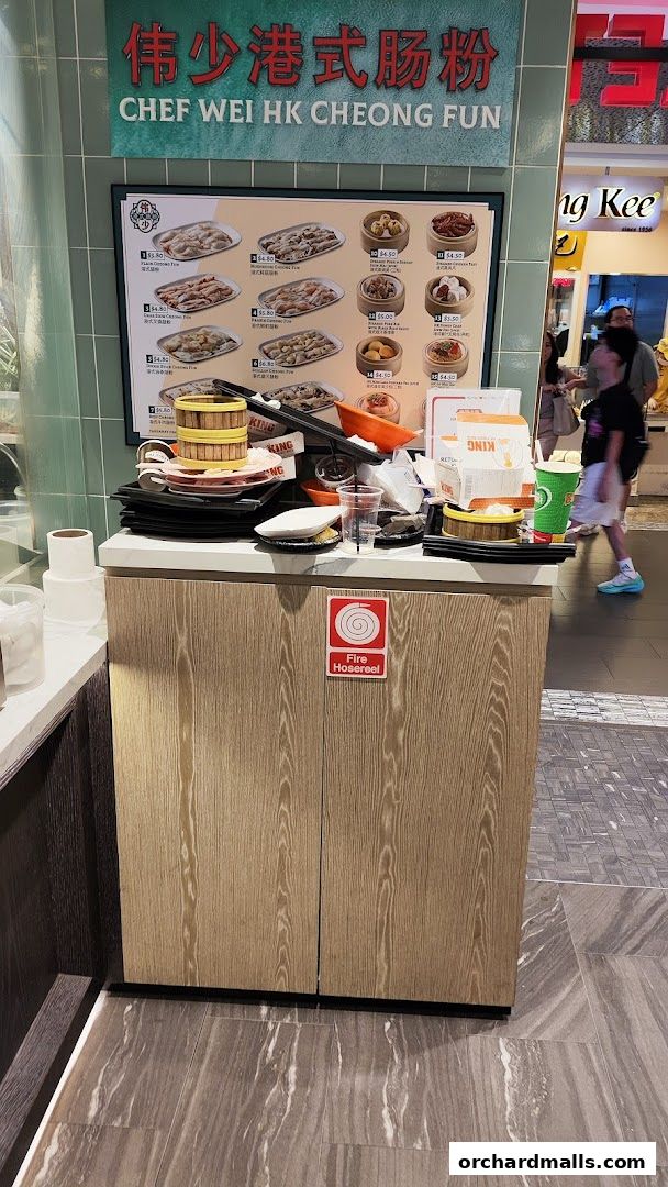 A menu board for Chef Wei HK Cheong Fun with various dim sum dishes and prices.