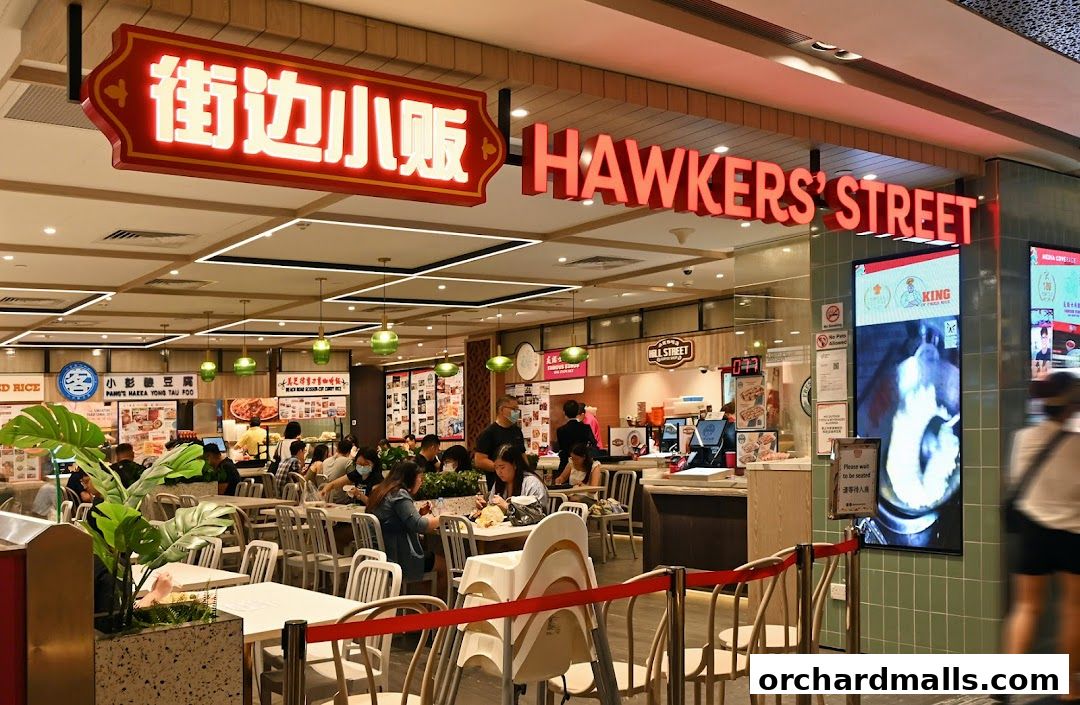 Interior view of a bustling food court with diners and various food stalls.