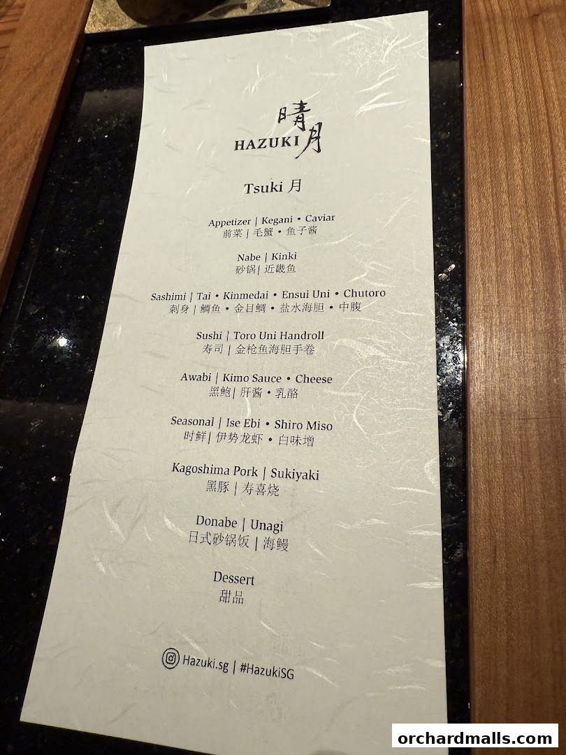 A menu from Hazuki restaurant featuring Japanese dishes like sashimi, sushi, and donabe.