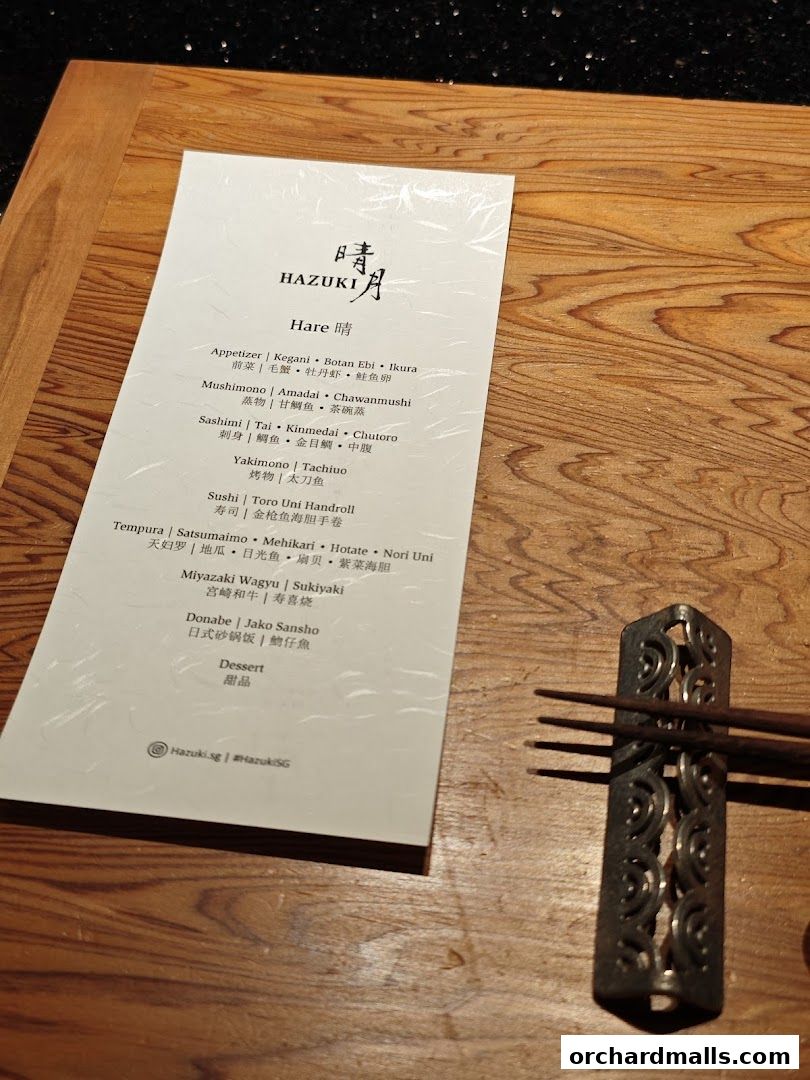 A menu from Hazuki restaurant featuring Japanese dishes like sushi, sashimi, and tempura.