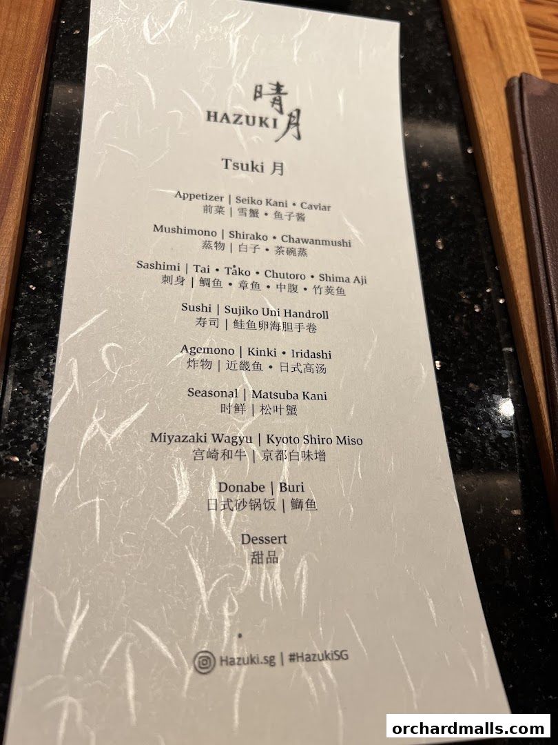 A menu from Hazuki restaurant featuring Japanese dishes like sashimi, sushi, and wagyu.