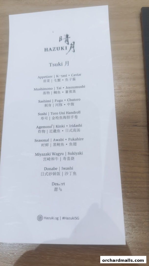 A menu from Hazuki restaurant featuring Japanese dishes like sushi, sashimi, and wagyu.