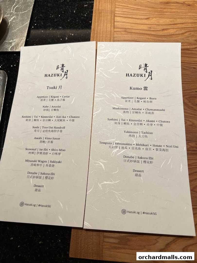 Two menus from Hazuki restaurant, featuring Japanese dishes like sushi, sashimi, and donabe.