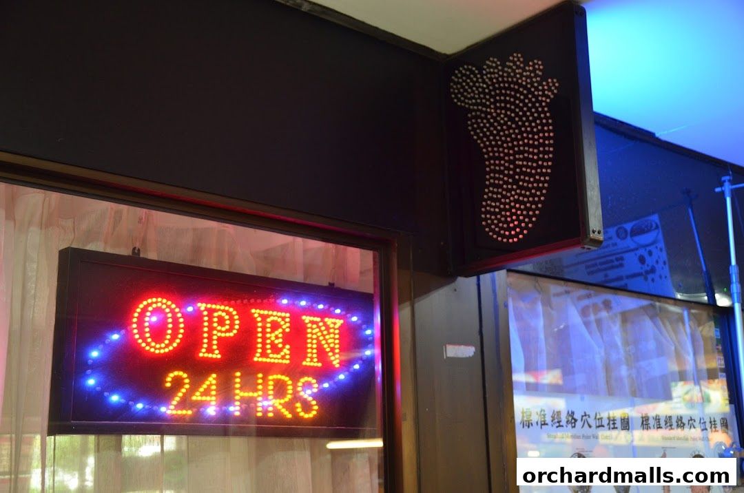 A neon sign reads 'OPEN 24 HRS' next to a foot graphic.
