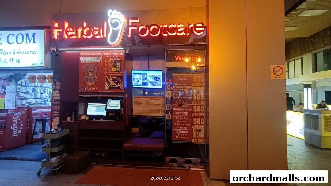 The storefront of Herbal Footcare, displaying services and prices for massages and footbaths.