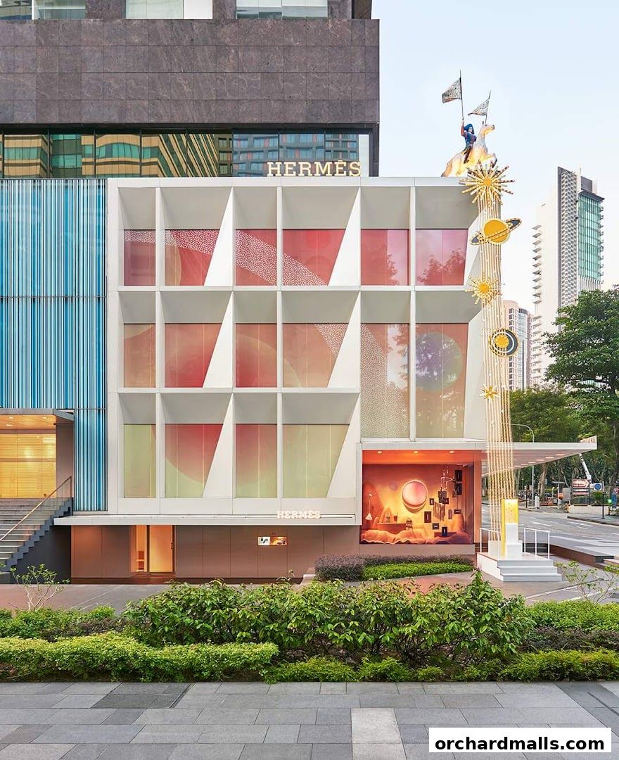 The exterior of the Hermès Singapore Takashimaya store with a festive window display.