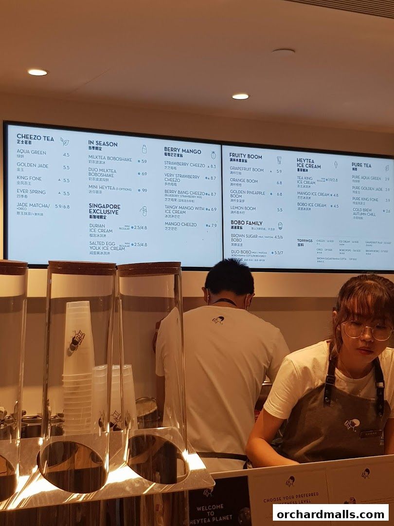 A menu board displaying various tea and ice cream options at HEYTEA.