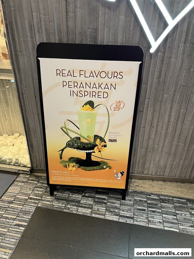 A-frame sign advertising a Pandan Coconut Shake with Peranakan-inspired flavors.