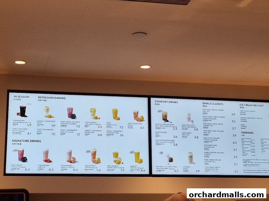A digital menu board displaying various refreshing drinks and desserts from HEYTEA.