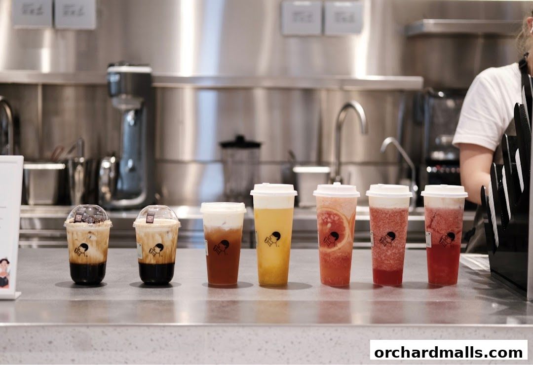 A selection of colorful and refreshing beverages lined up on a counter at HEYTEA.