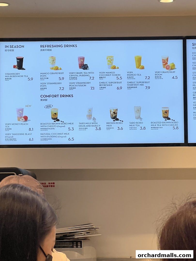 A digital menu board displaying various refreshing and comfort drinks with prices.