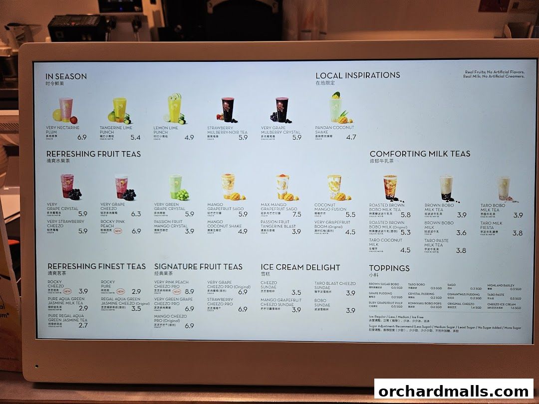 A digital menu displaying various fruit teas, milk teas, and toppings with prices.