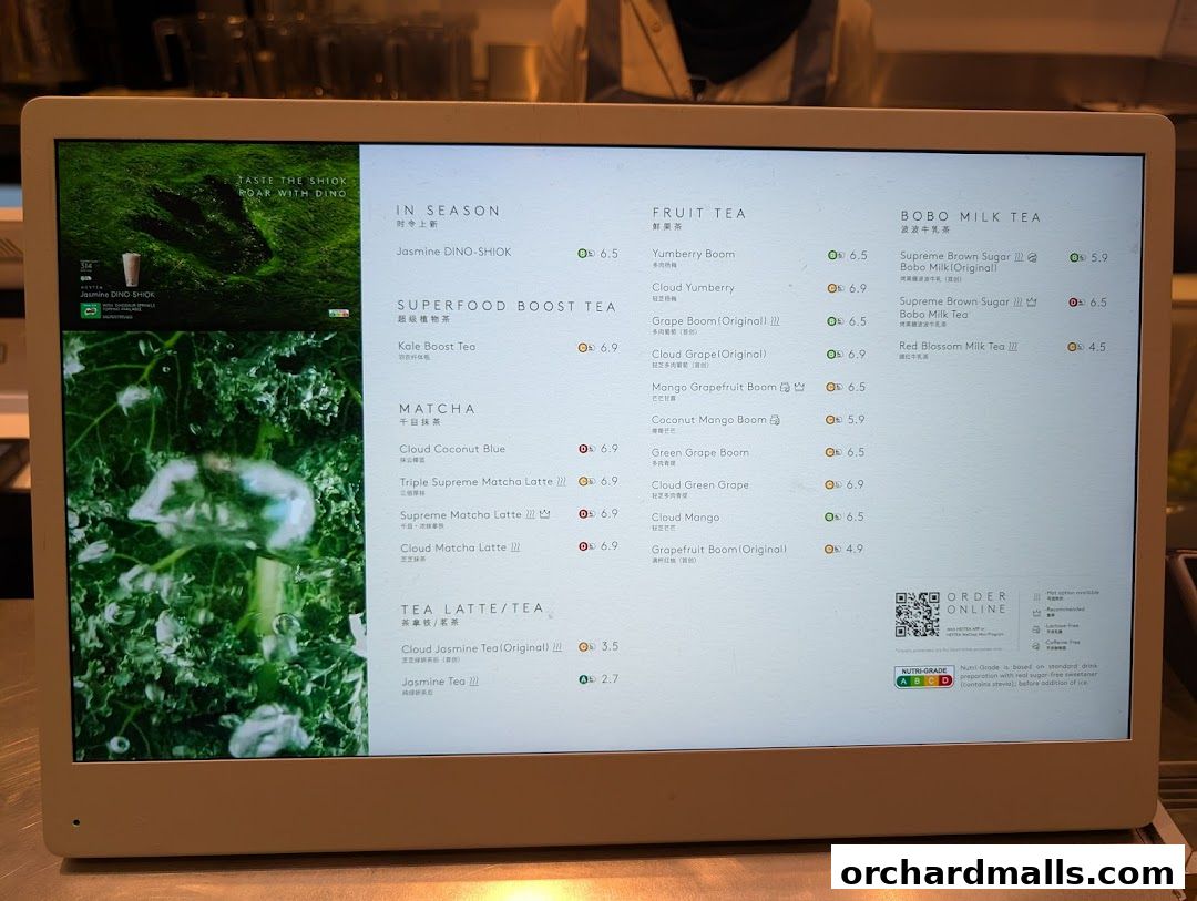 A digital menu displaying various tea drinks with prices and categories.