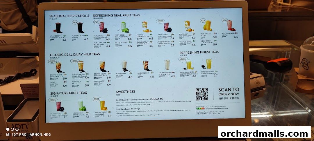 A digital menu displaying various fruit teas, milk teas, and signature teas with prices.