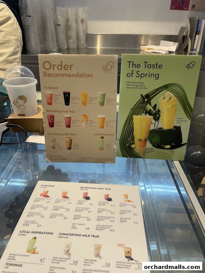 A menu board displaying various tea recommendations and drink options from HEYTEA.