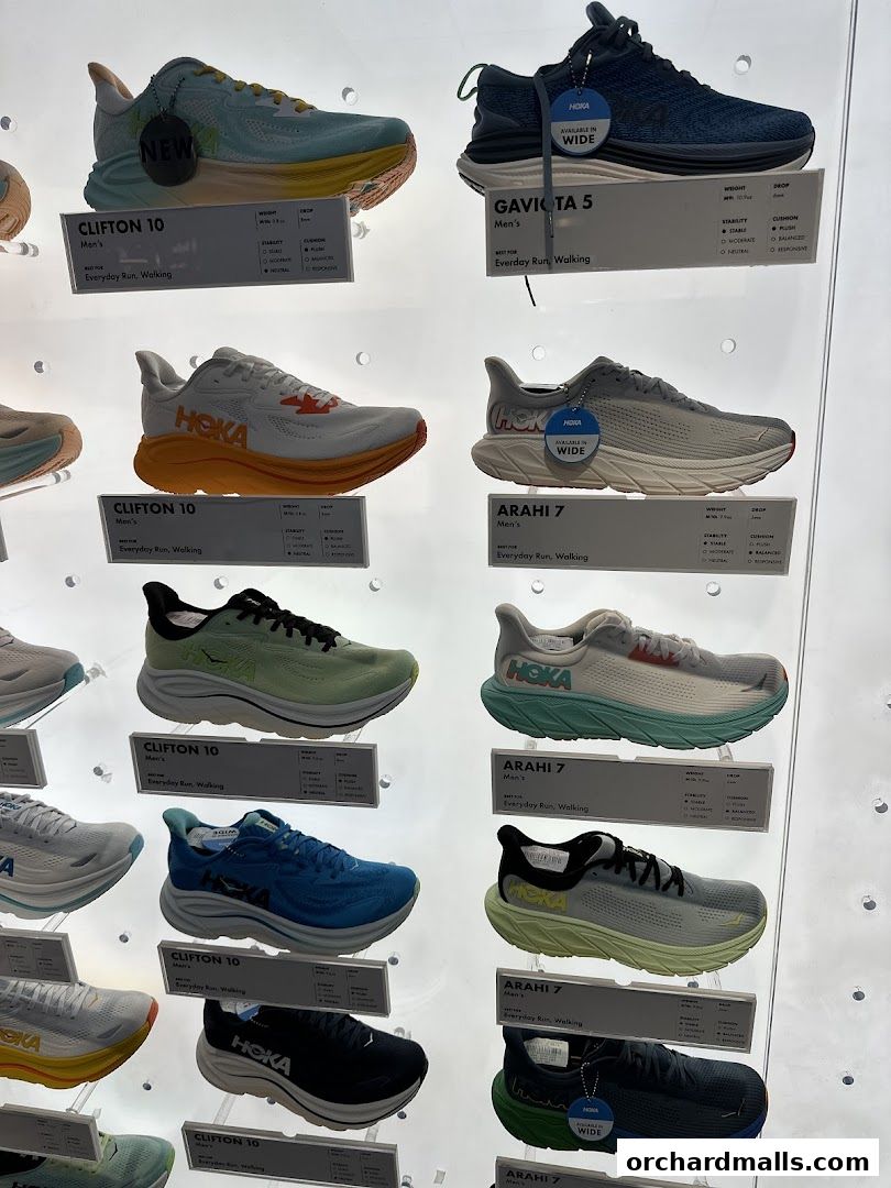 A display of various Hoka running shoes, showcasing different models and colors.