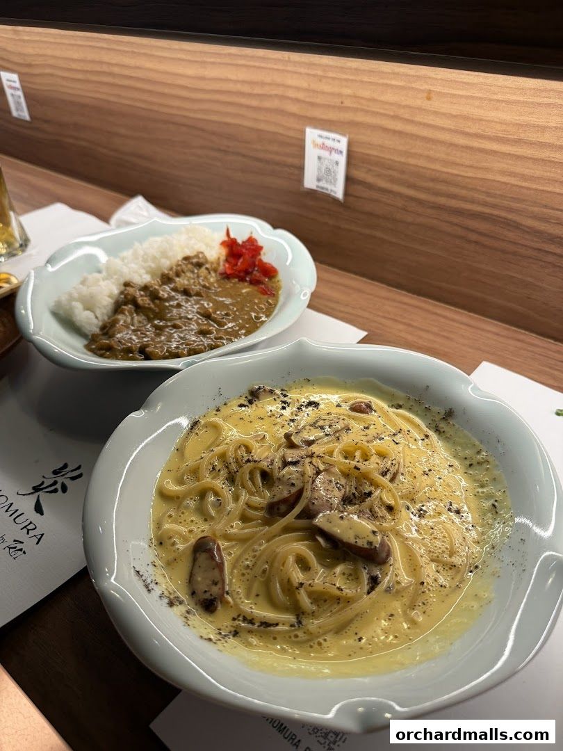 Two delicious Japanese dishes, curry rice and creamy pasta, served at Homura by Kai Izakaya.