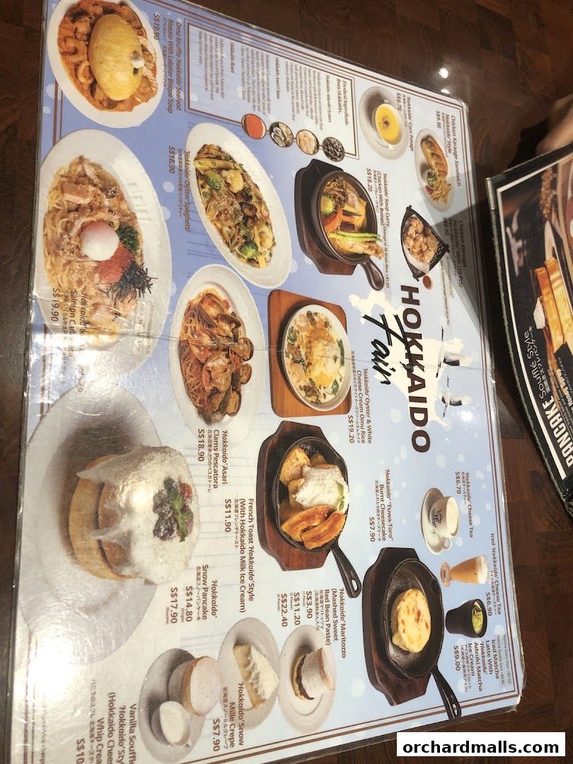 A menu featuring various Hokkaido-themed dishes and desserts with appealing food photography.