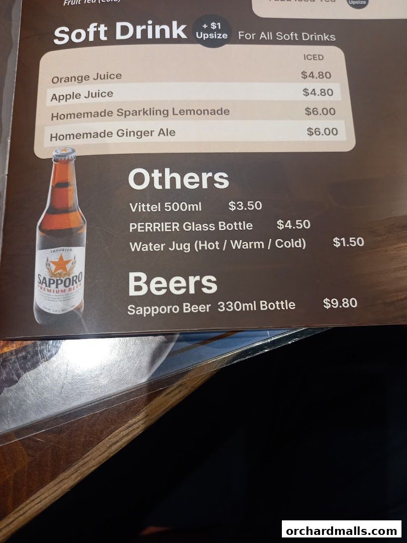 A menu featuring soft drinks, other beverages, and beers with prices.