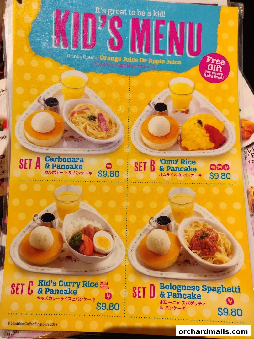 A colorful menu showcasing four different kids' meal sets with pancakes and drinks.