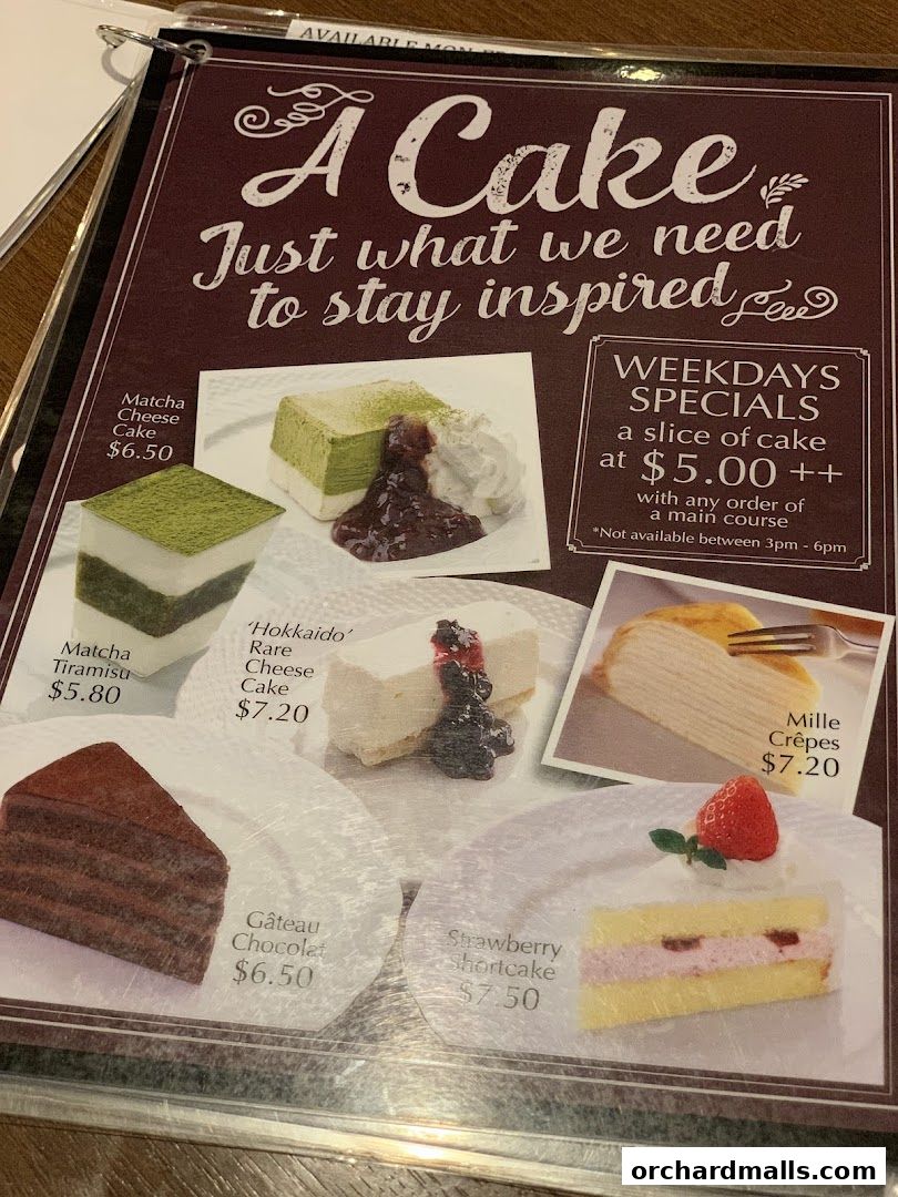 A menu featuring various cakes and desserts with prices and a weekday special offer.