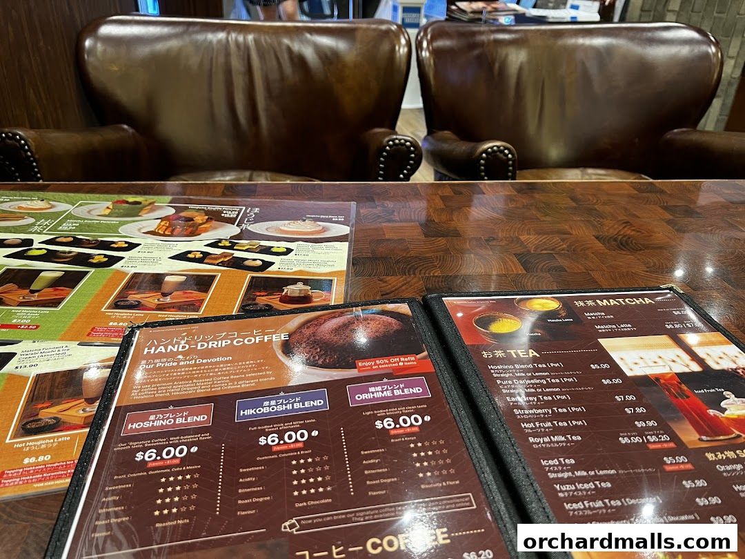 A close-up view of Hoshino Coffee's menu, featuring coffee and tea options.