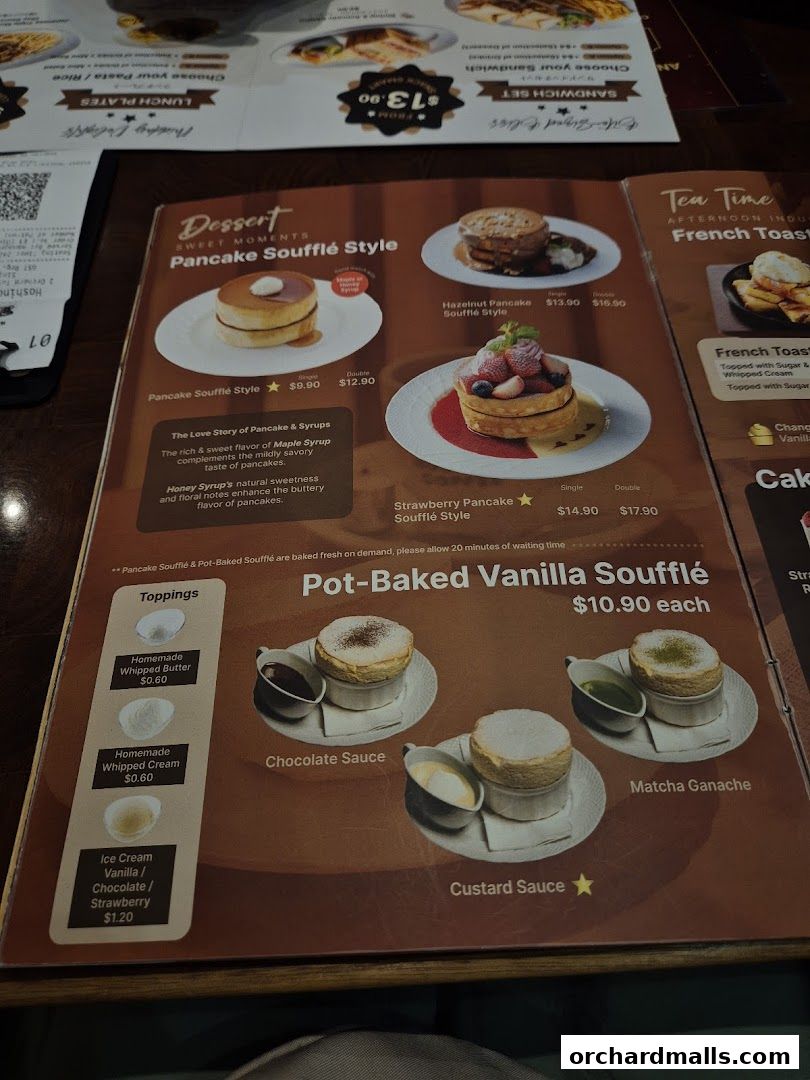 A menu featuring pancake soufflés, pot-baked vanilla soufflés, and toppings.