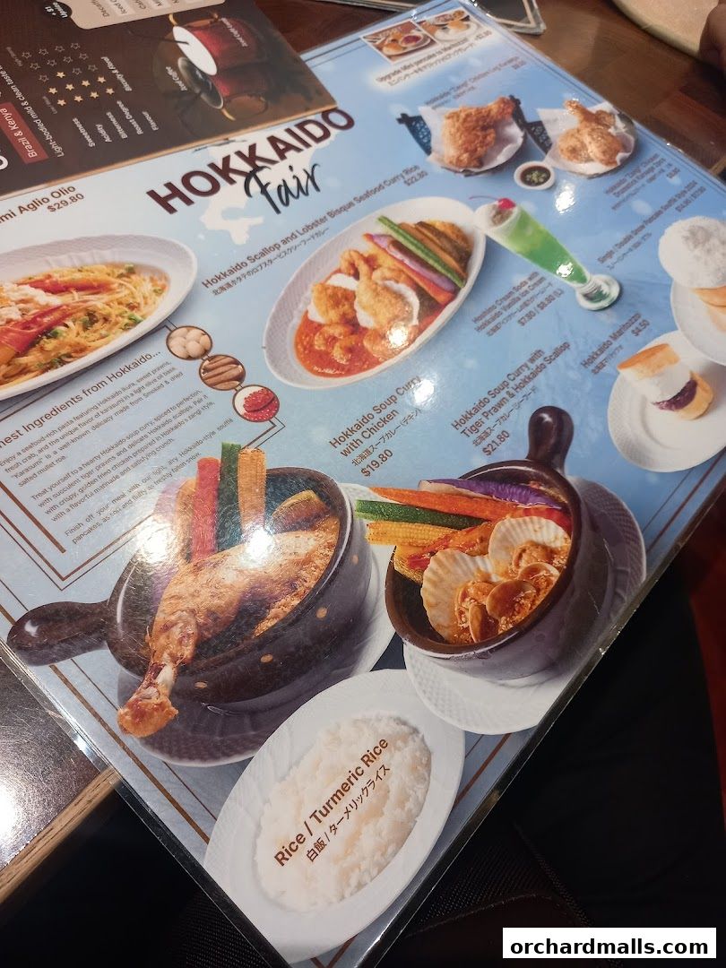 A menu featuring Hokkaido Fair dishes, including seafood curry, soup curry, and desserts.