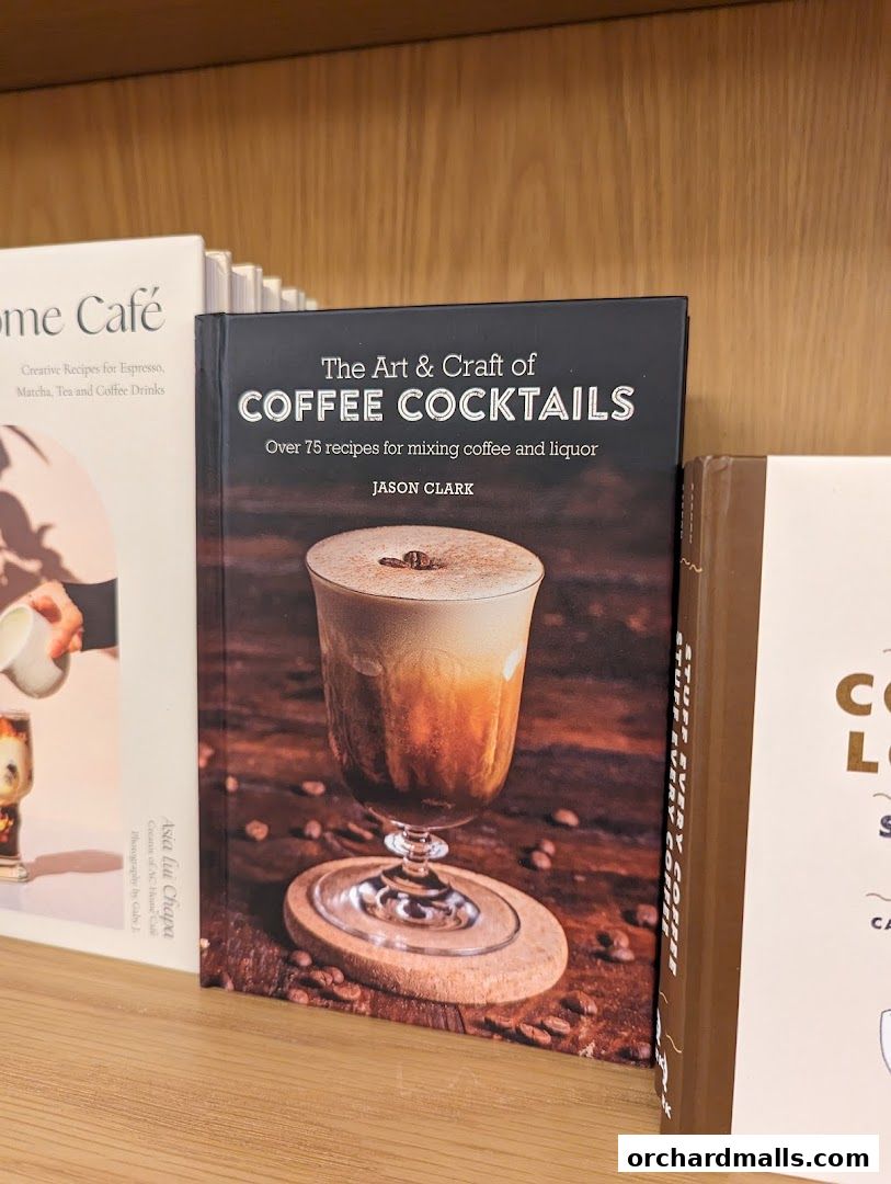 A book titled 'The Art & Craft of Coffee Cocktails' is displayed on a shelf.