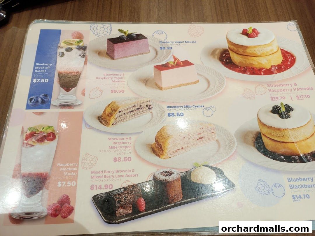 A menu featuring various berry-themed desserts and drinks with prices.