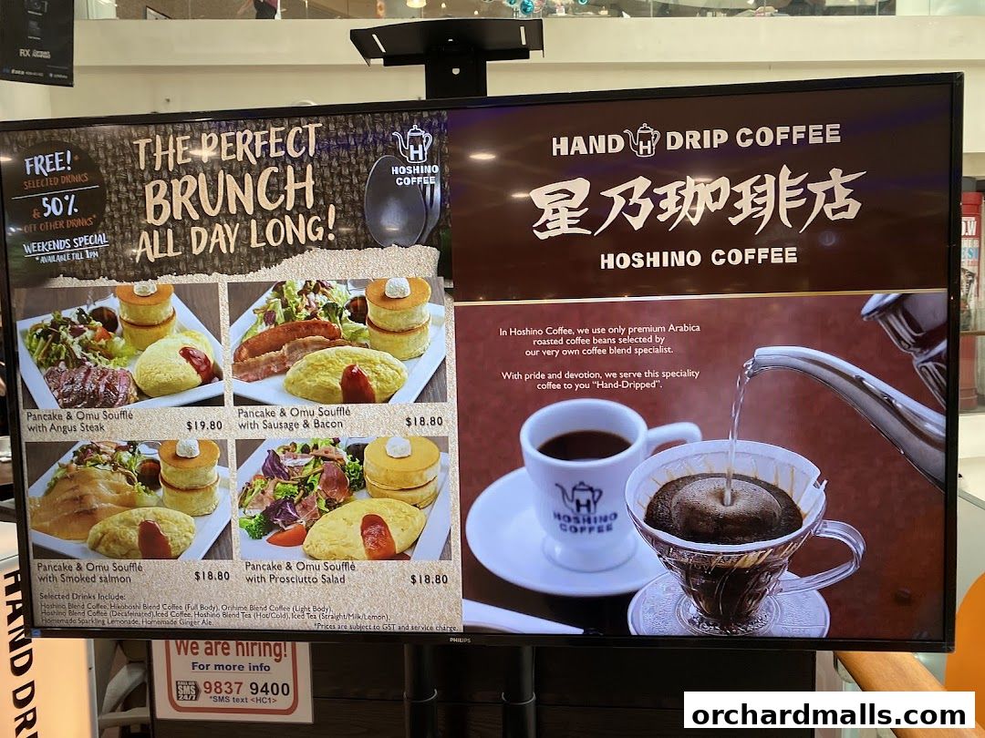 A digital menu board showcasing brunch items and hand-drip coffee at Hoshino Coffee.