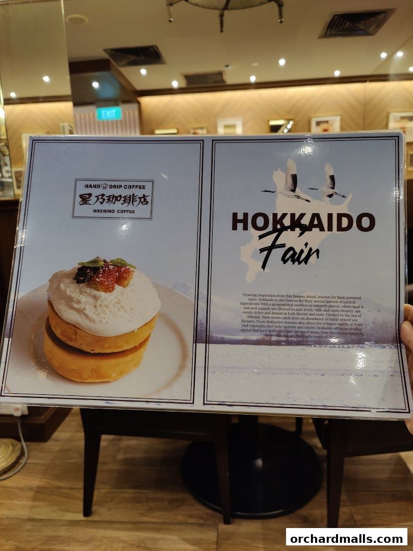 A menu featuring Hoshino Coffee's Hokkaido Fair with a pancake and descriptive text.