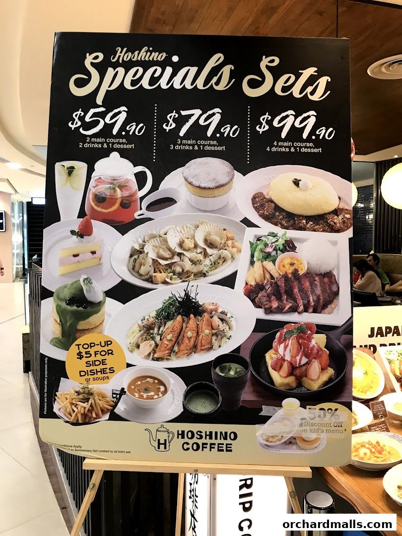 A menu board showcasing Hoshino Coffee's special meal sets with prices and food images.
