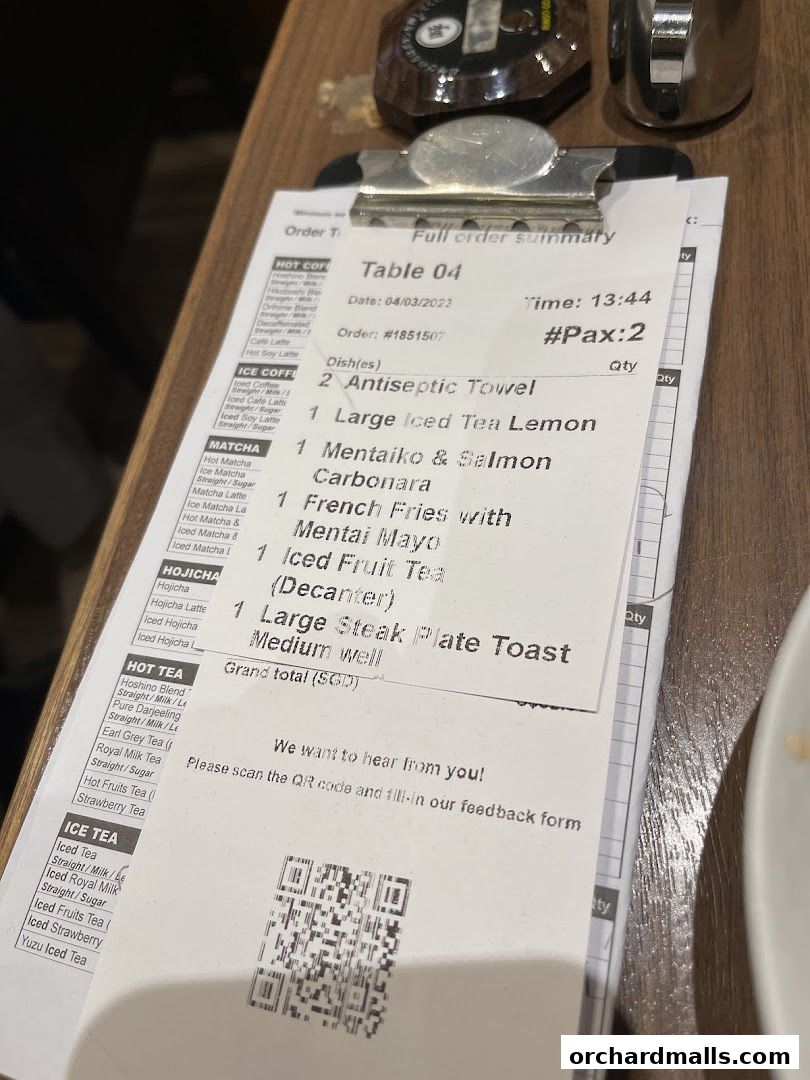 A close-up of a Hoshino Coffee order summary with food and drink items listed.