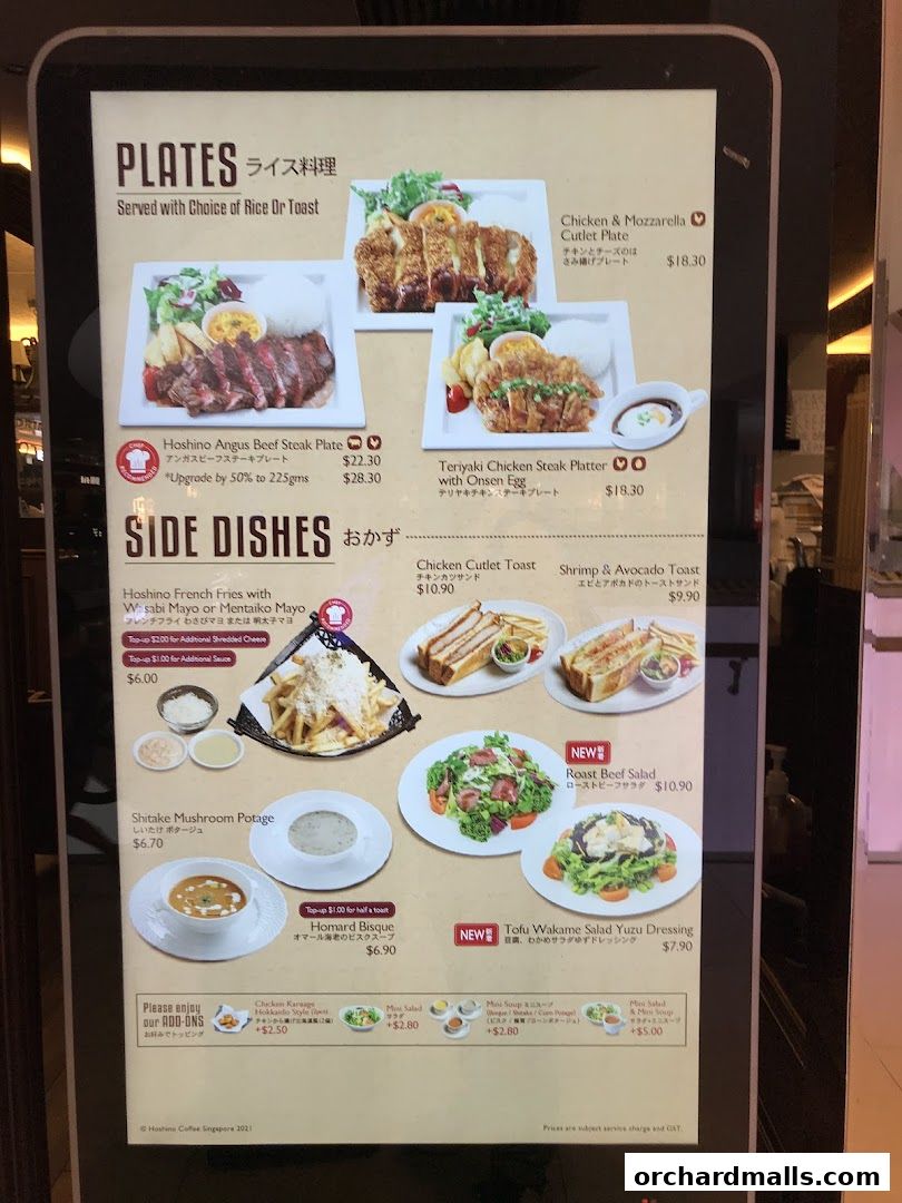 A digital menu board displaying various plates, side dishes, and salads from Hoshino Coffee.