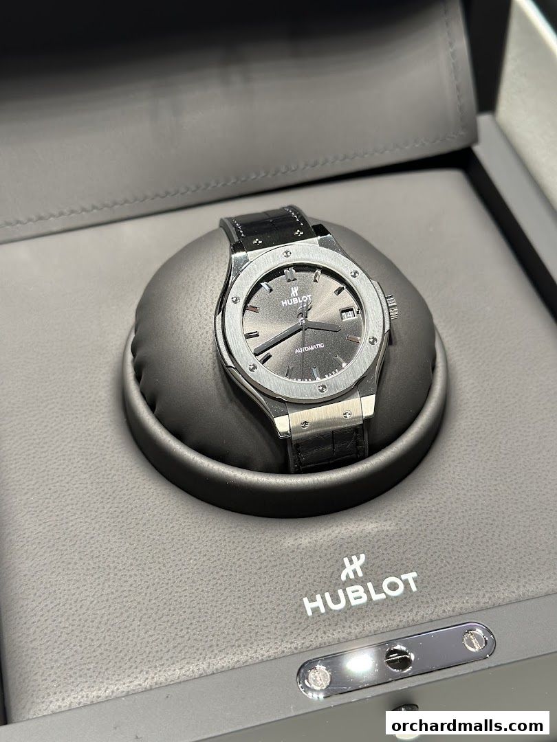 A luxury Hublot automatic watch displayed in its branded presentation box.