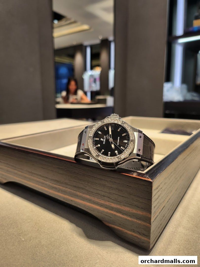 A close-up of a luxury Hublot watch with a diamond-encrusted bezel on display.