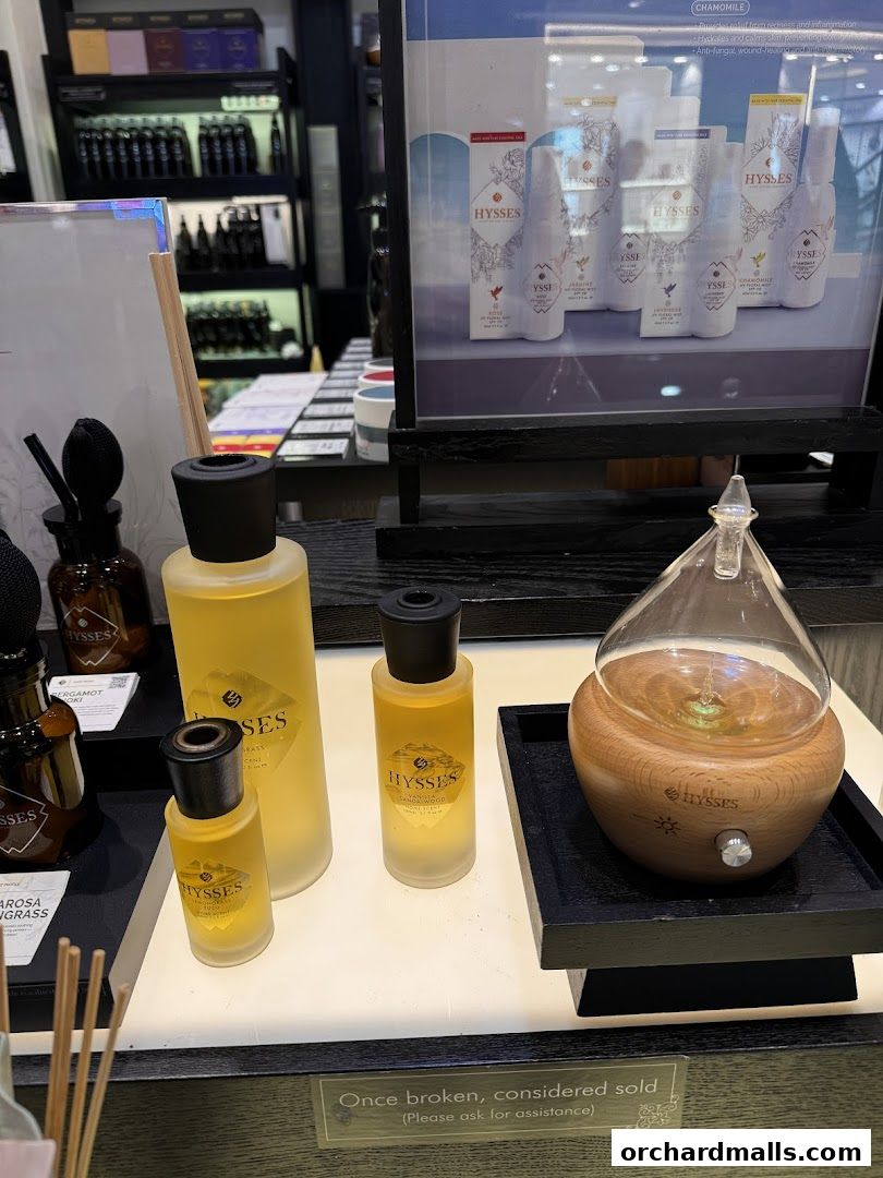A display of HYSSES aromatherapy essential oils and an oil diffuser.