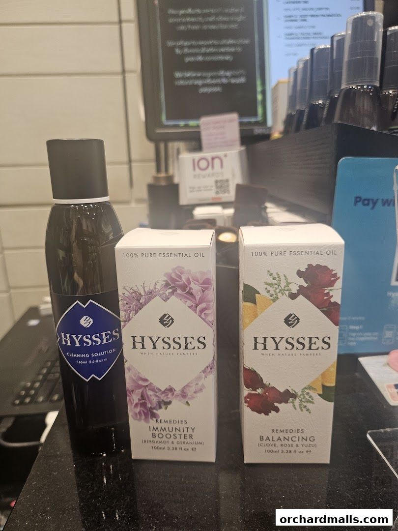 HYSSES essential oils and cleaning solution displayed on a counter.