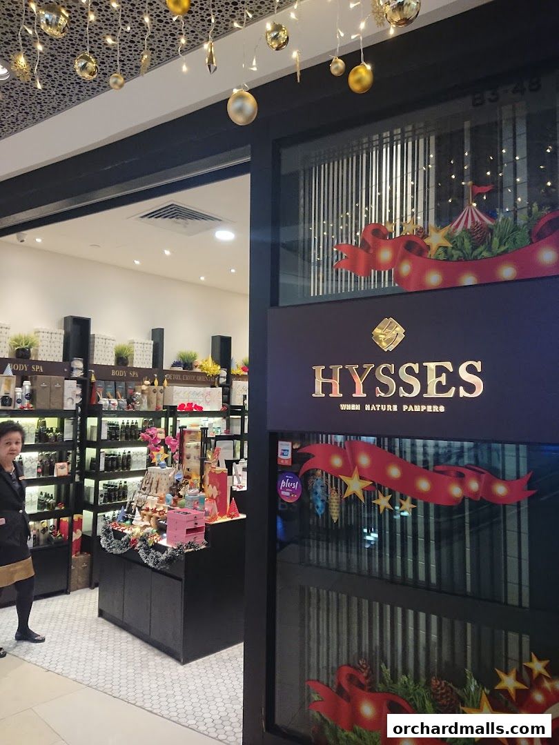 The entrance of HYSSES, an aromatherapy and essential oils shop, with festive decorations.