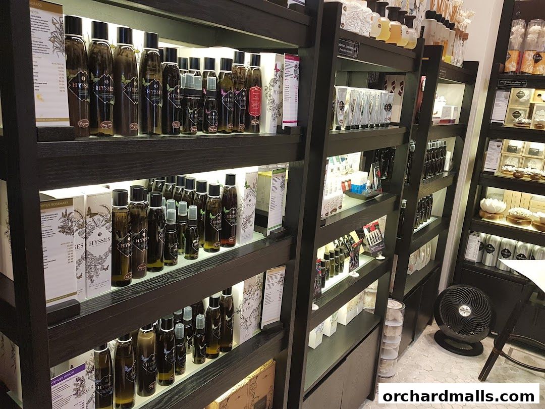 Shelves filled with various aromatherapy essential oil bottles and products.