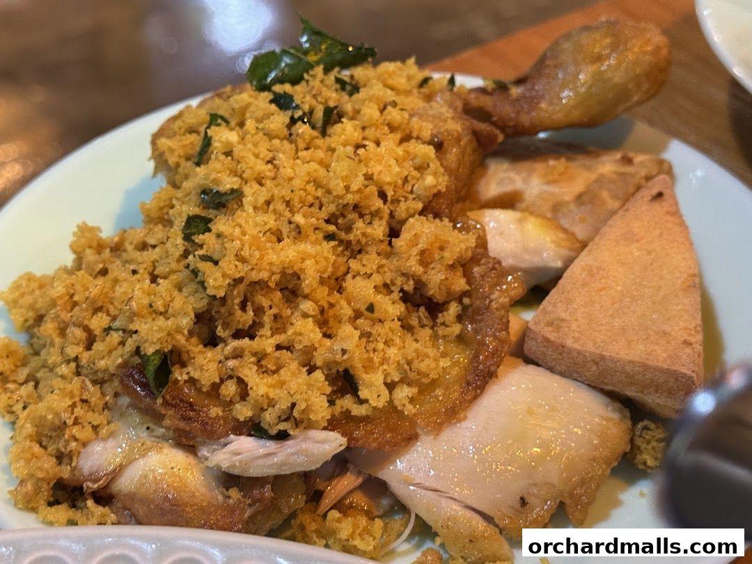 A close-up of a delicious dish featuring crispy fried chicken and tofu.