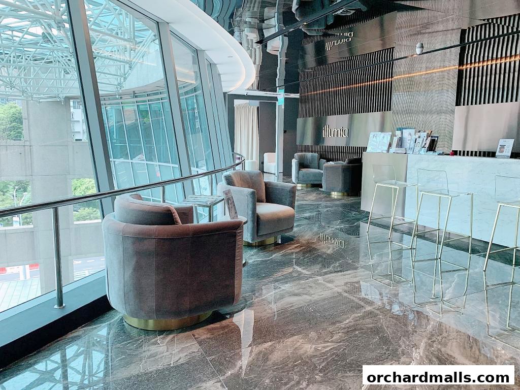 Interior of a modern aesthetic clinic with plush seating and a reception desk.