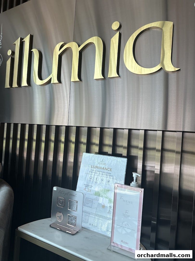 Illumia Medical Orchard aesthetic clinic's reception area with branding and service information.