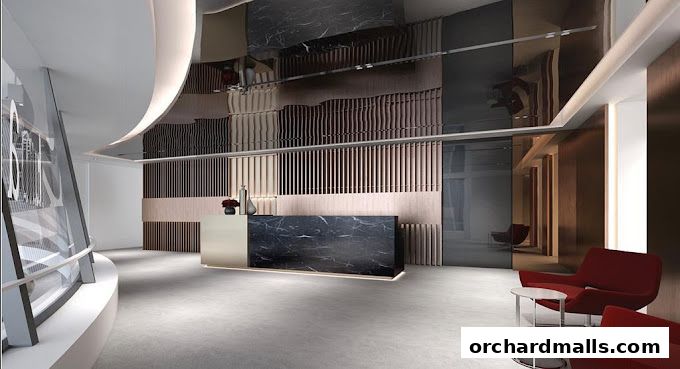 Modern reception area with a marble desk, stylish seating, and decorative wall panels.