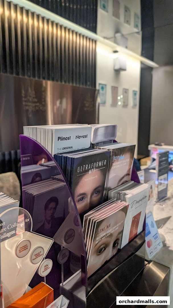 Brochures and pamphlets displayed on a counter at a medical spa.